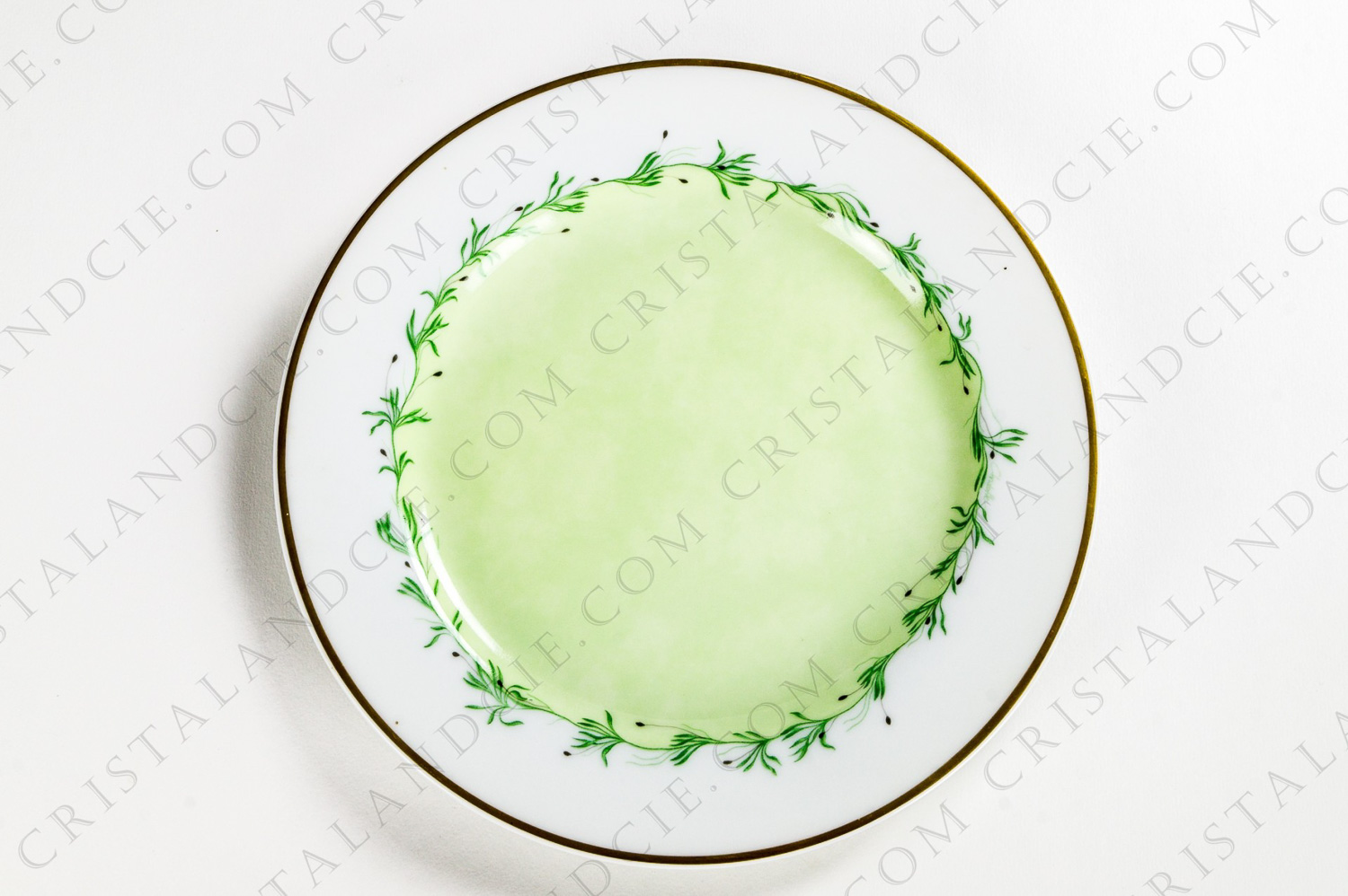 Dessert plate in china by Christofle pattern Bagatelle with a vegetable frieze encircling a green backgroung and a golden frieze photo-1