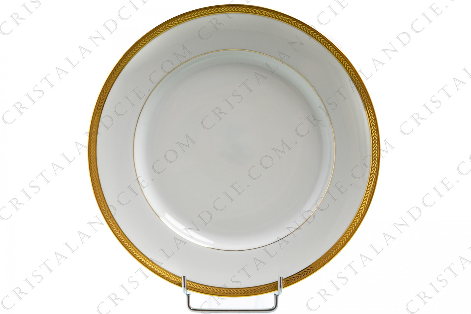 Assiette plate en porcelaine de Limoges de la maison Lafarge ornée d une frise de feuilles de lauriers en incrustations or photo-1