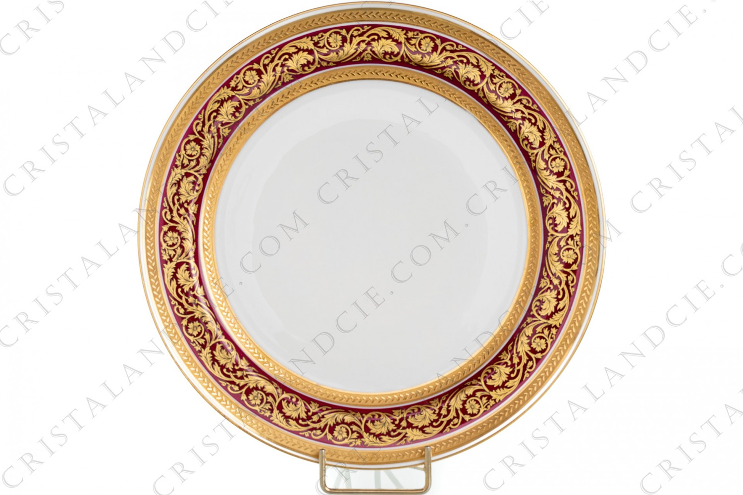 Dinner plate in Limoges china by Bernardaud pattern Chambord pink, decorated with a gold frieze of flowered foliage on a pink background, framed by two friezes in gold inlays photo-1