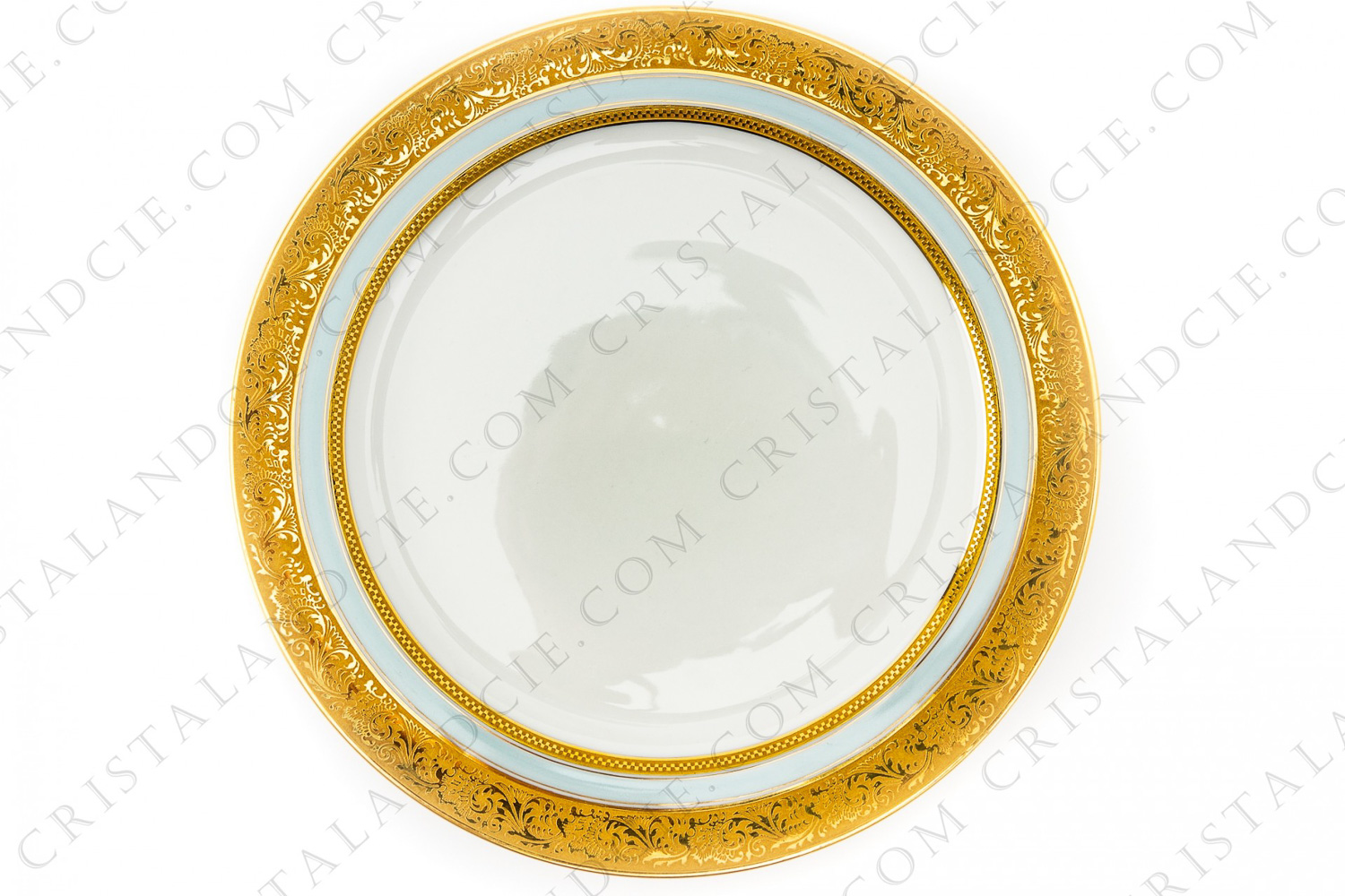 Assiette plate en porcelaine de Limoges de la maison Vignaud ( Bernardaud) à décor d incrustations or et filet bleu clair photo-1