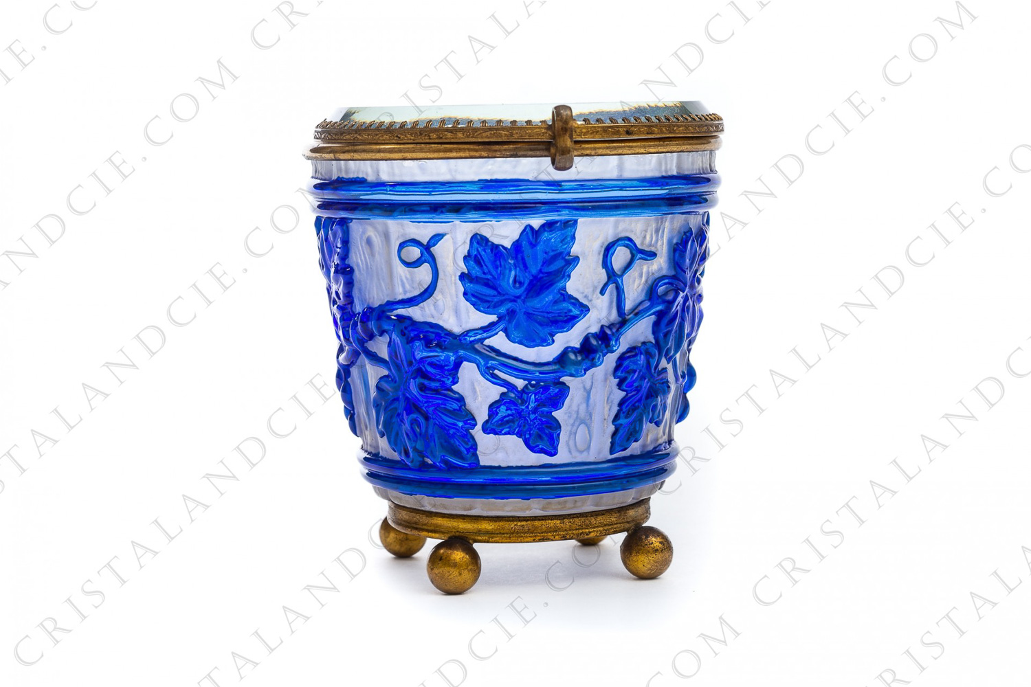 Box in blue molded doubled, satin and polished crystal by Baccarat decorated with grapevine on a background seems like a barrel photo-1