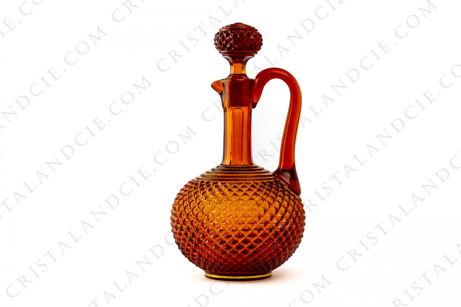 Decanter in amber molded crystal by Baccarat decorated with diamond tips and a golden strip photo-1