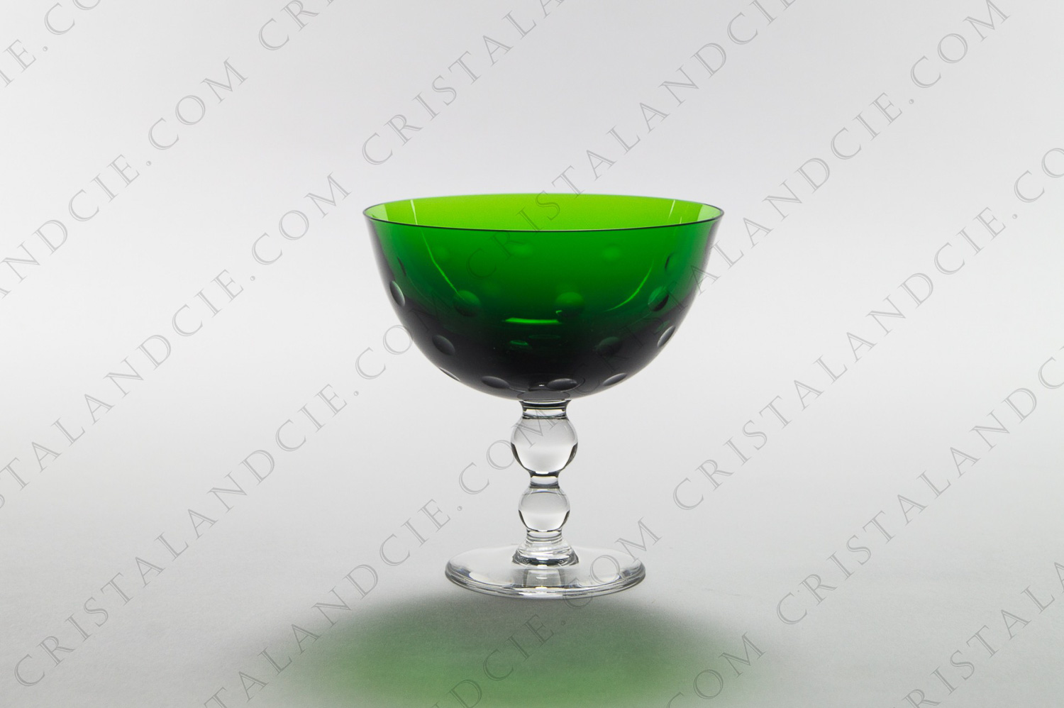 Footed cup in green crystal by Saint-Louis pattern Bubbles with a carved decor photo-1