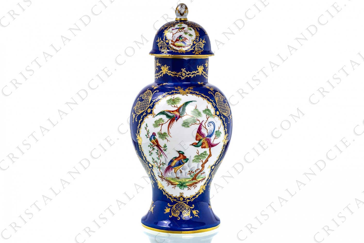 Towering covered vase in china hand decorated by the workshops Le Tallec, decorated with hand painted polychromes birds of paradise on a dark blue background adorned with gold relief foliage photo-1