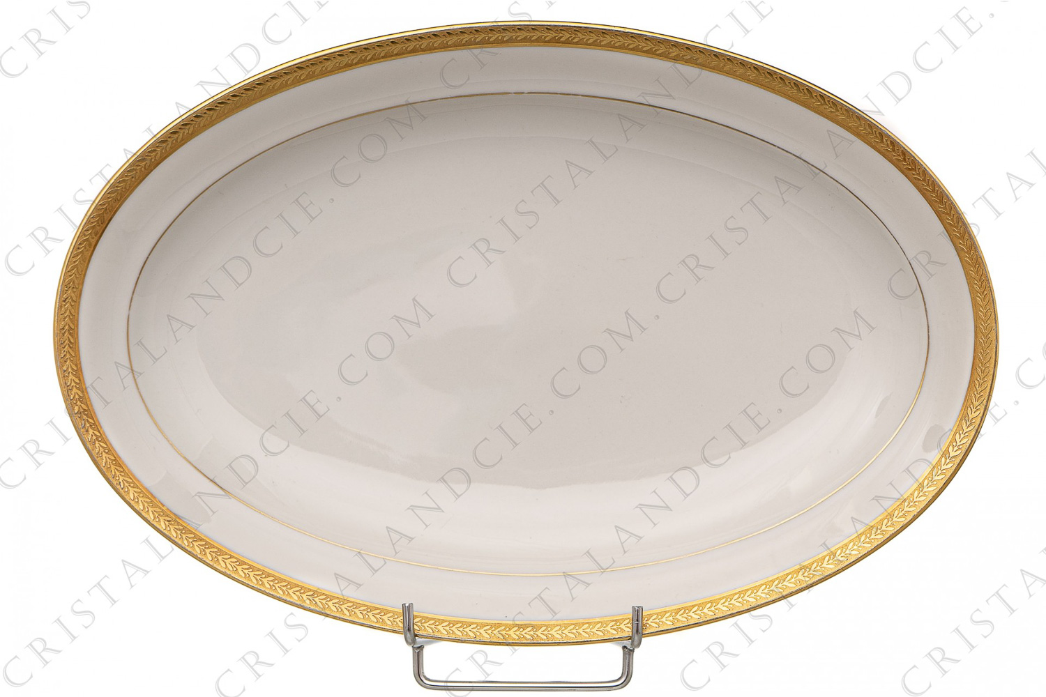 Petit plat ovale en porcelaine de Limoges de la maison Chastanier orné d une frises de lauriers en incrustations or photo-1