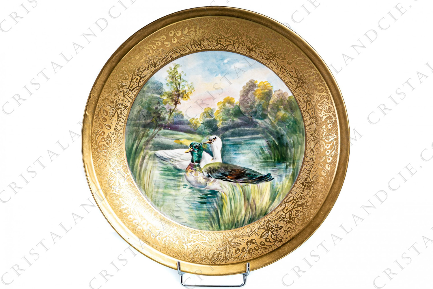 Round deep dish in Limoges china by Theodore Haviland presenting in a hand painted pattern of two ducks in a lakeside landscape its center and a large plant frieze in gold inlays photo-1