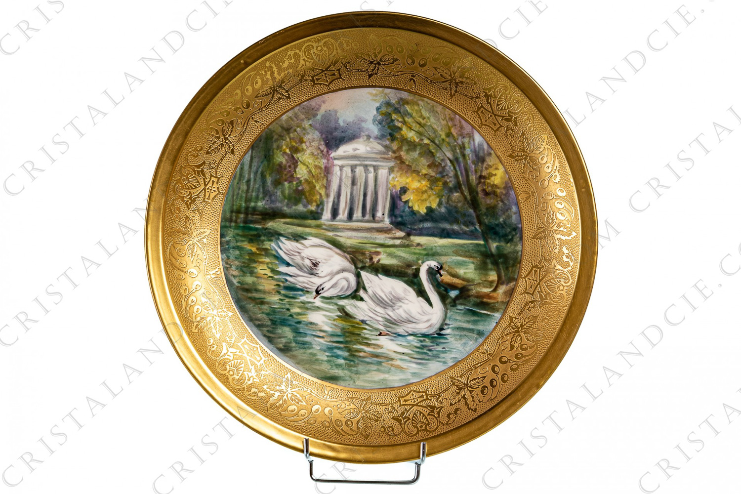 Round deep dish in Limoges china by Theodore Haviland presenting in a hand painted pattern of two swans and an ancient temple in a lakeside landscape its center and a large plant frieze in gold inlays photo-1