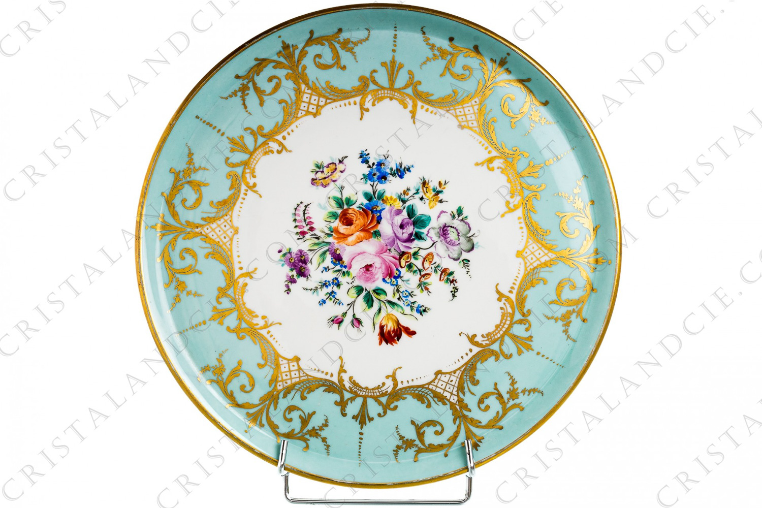 Dish in china hand decorated by the workshops Le Tallec, decorated in the middle by hand painted polychromes flowers, et by gold foliages on a sky blue background photo-1