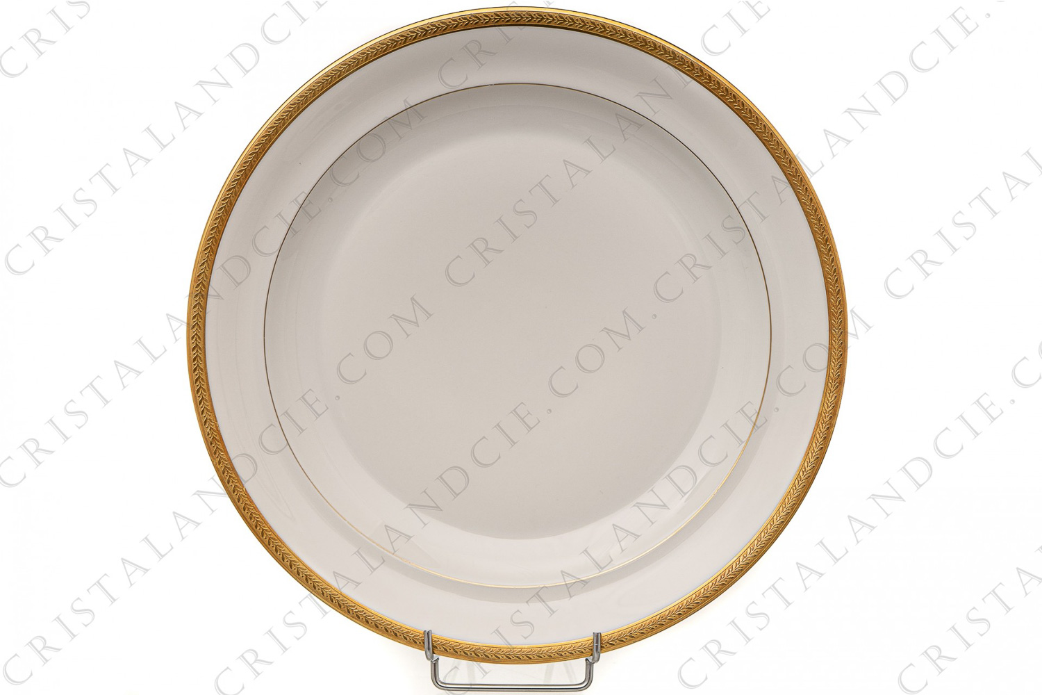 Plat rond en porcelaine de Limoges de la maison Chastanier orné d une frises de lauriers en incrustations or photo-1
