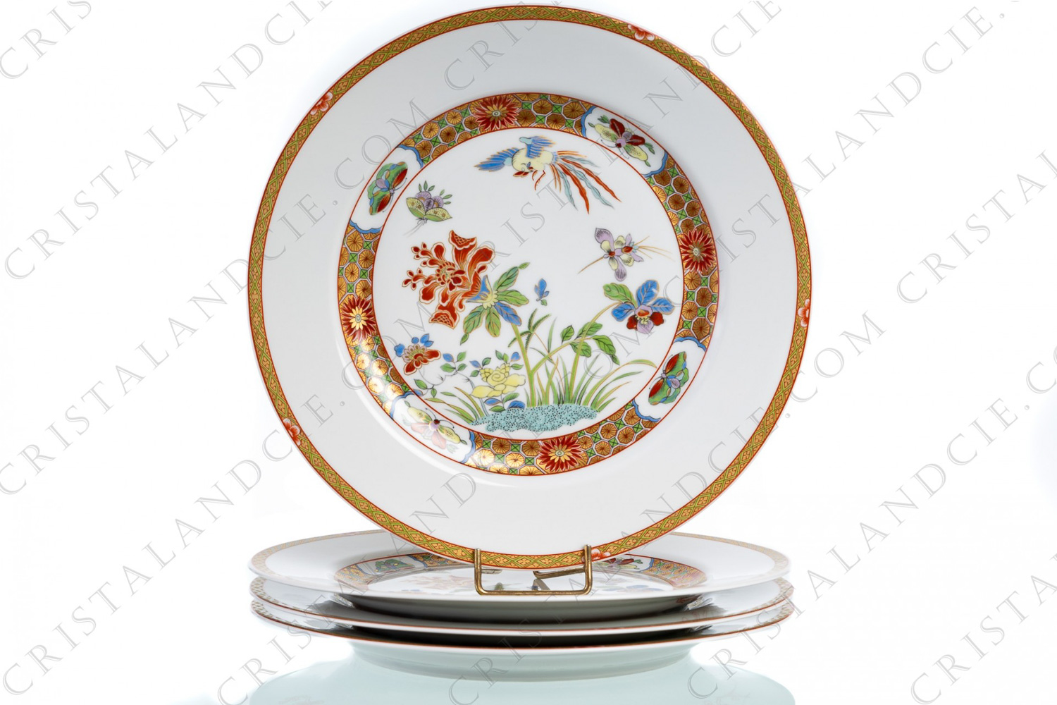 Set of four dinner plates in Limoges china by Bernardaud pattern Chef d Œuvre decorated with polychromes and gold flowers and bird of paradise, and with friezes of flowers and butterflies, inspired by a pattern of the imperial china manufacture King-Tö-Tchen of the beginning of the 18th century photo-1