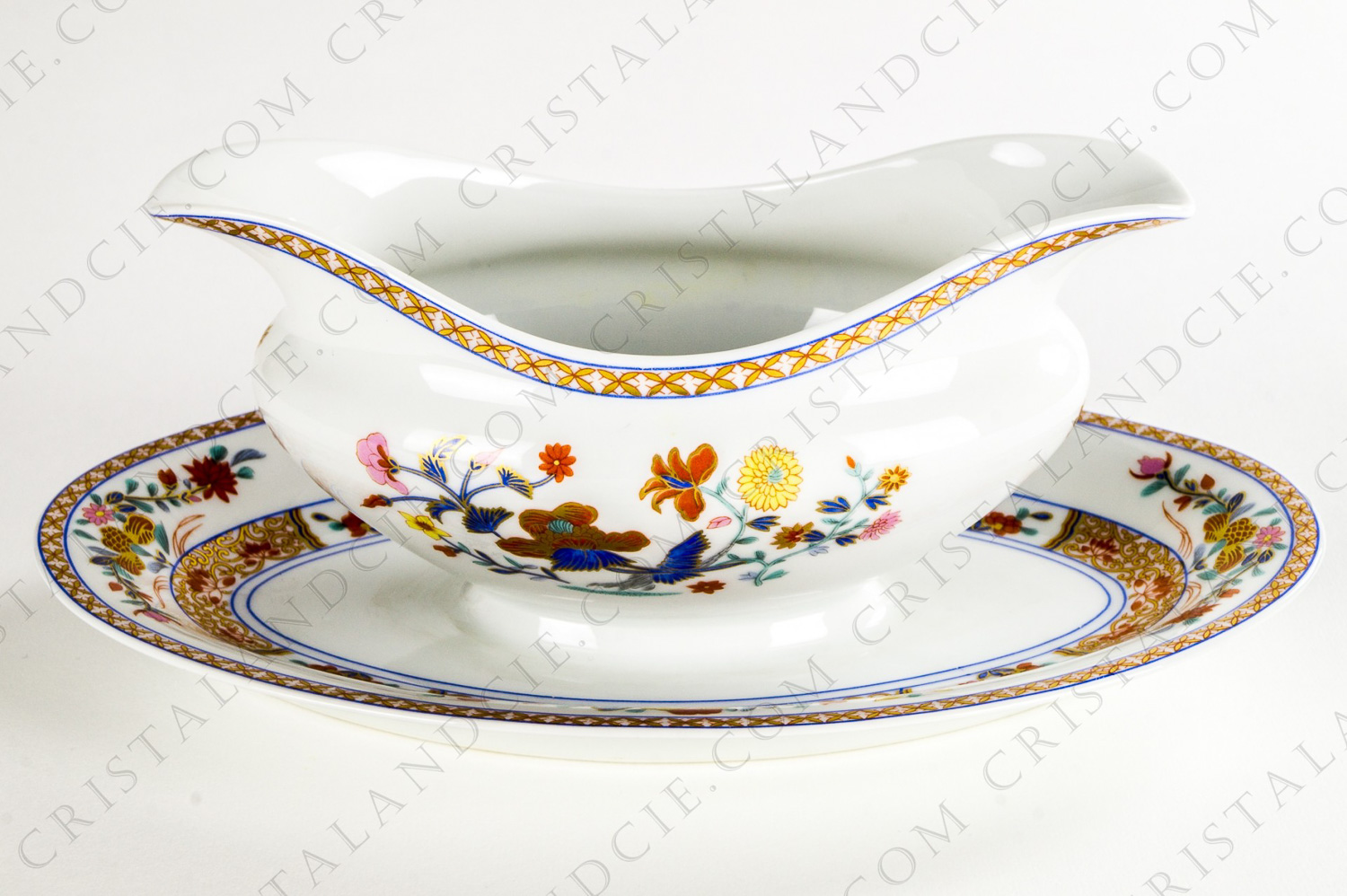 Gravy boat in Limoges China by Bernardaud pattern Pondichéry decorated with polychromes and gold flowers photo-1