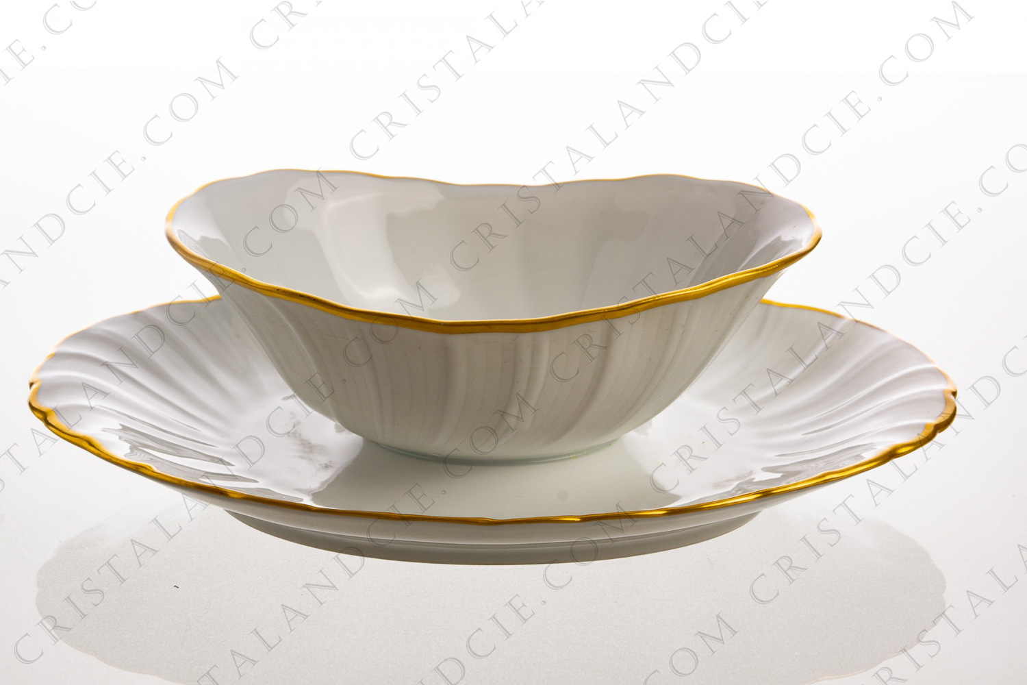 Gravy boat in Limoges china by Bernardaud pattern Verlaine decorated with palmettes and a gold border photo-1