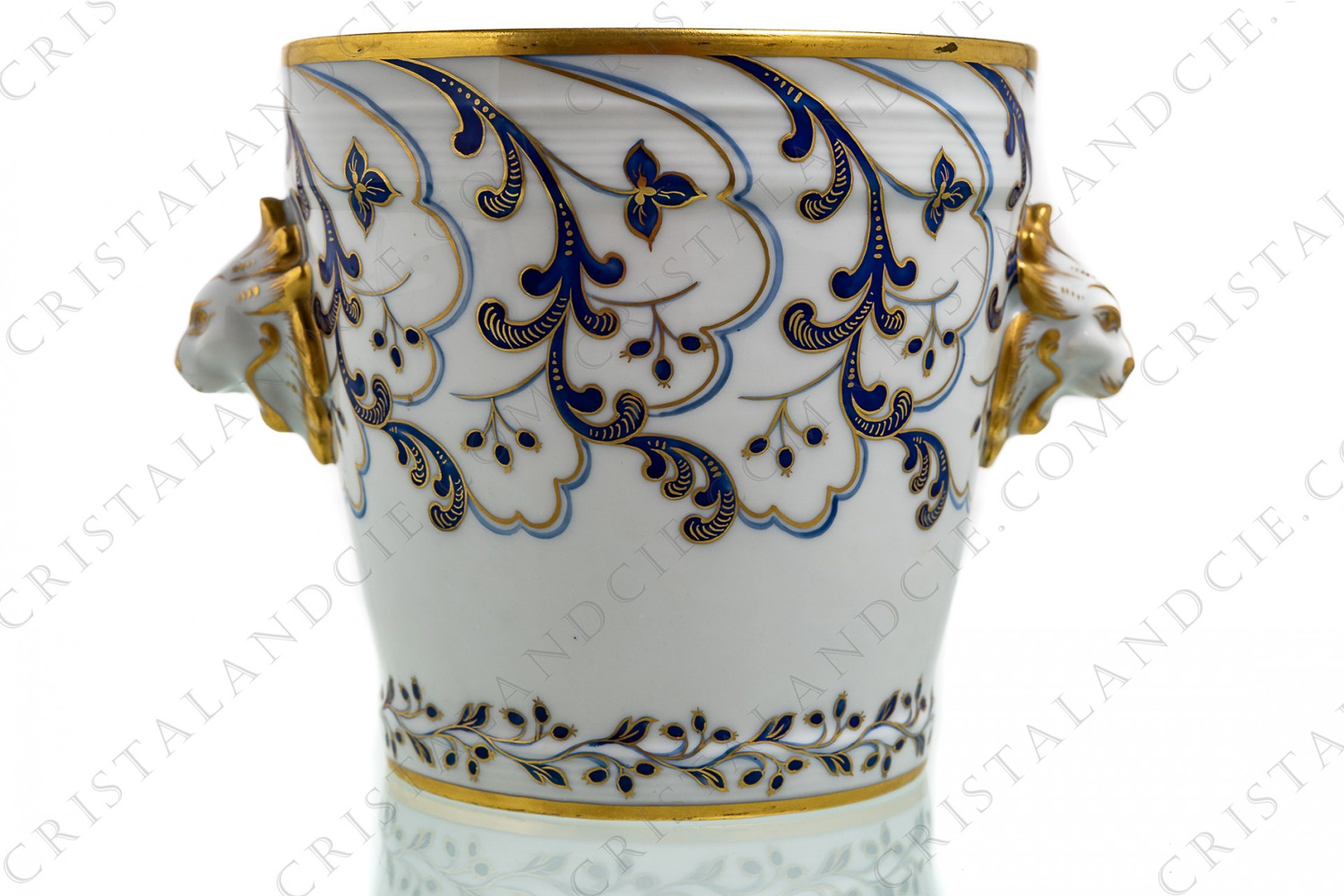 Ice bucket in china hand decorated by the workshops Le Tallec decorated with blue and gold foliage and with gold lions head as handles photo-1