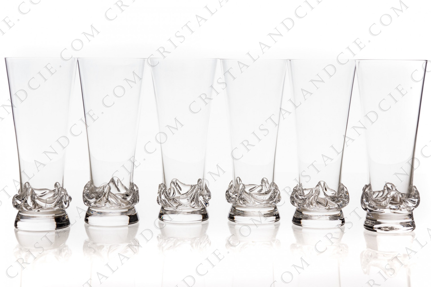 Série de six flûtes à Champagne en cristal de Daum modèle Sorcy à décor de vaguelettes à la base photo-1