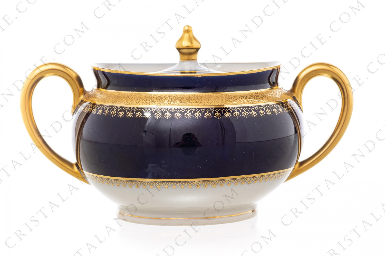 Sugar bowl in china of Limoges by Theodore Haviland decorated with a gold inlays arabesques frieze on a cobalt blue background photo-1