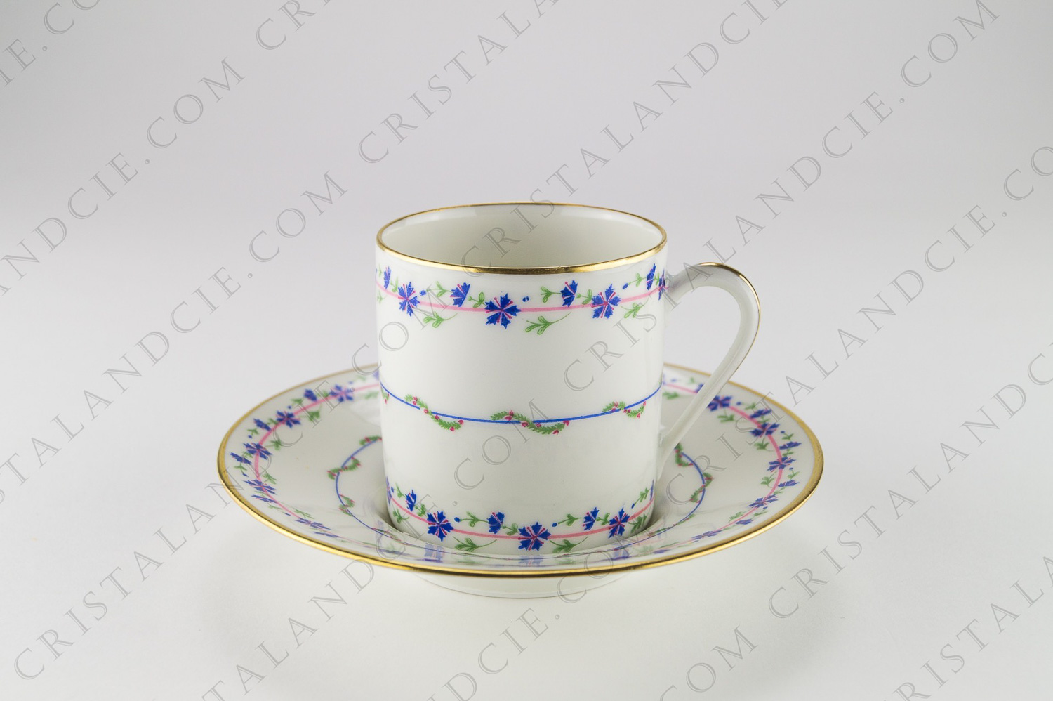 Coffee cup in Limoges china by Raynaud pattern with cornflowers,decorated with cornflowers and gold borders, a rose in the bottom of the cup and of the saucer photo-1