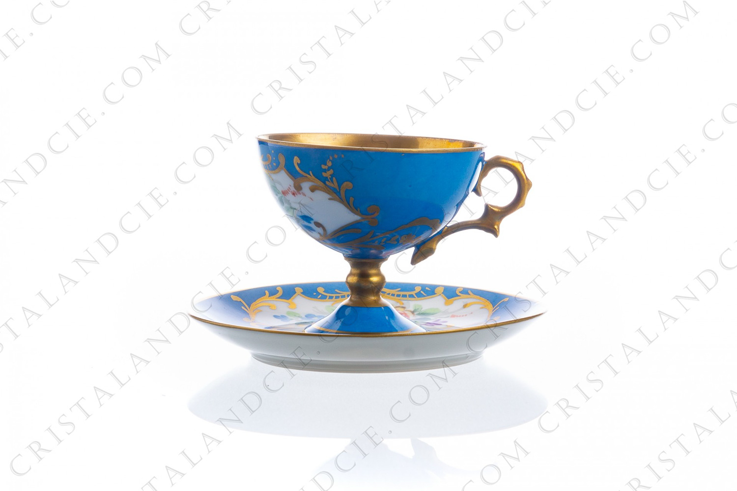 Coffee cup on foot in Limoges china, hand painted with polychromes flowers on a blue and gold background photo-1