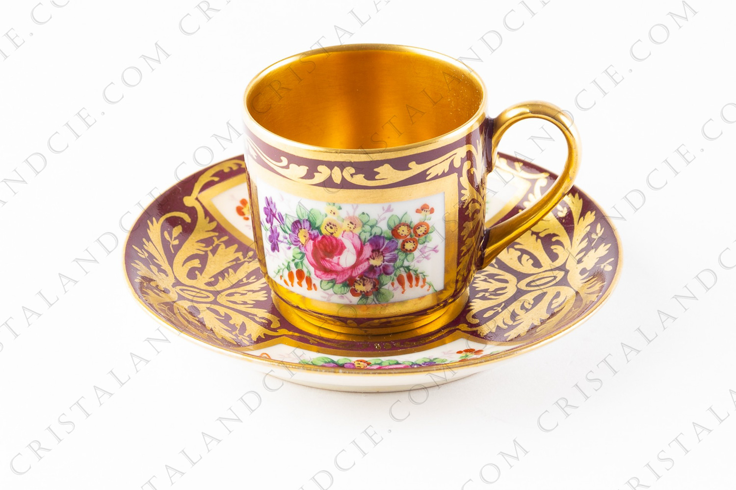 Moka cup in Limoges china decorated with hand painted polychromes bouquets of flowers an gold arabesques on a red background photo-1