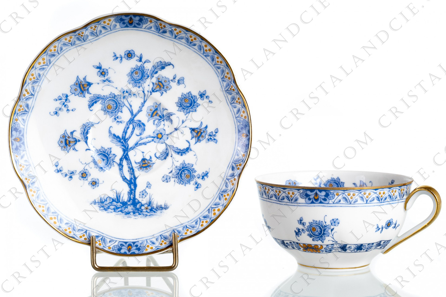 Tea cup in Limoges china by Haviland pattern Arbre blue shape Lutece decorated with a blue flowered tree in the middle, with vegetables friezes and with a gold border photo-1
