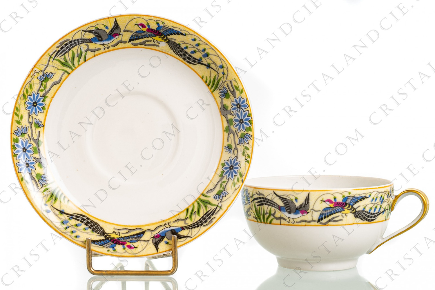 Tea cup in Limoges china by William Guerin and Cie decorated with a polychrome frieze of flowers and birds of paradise photo-1