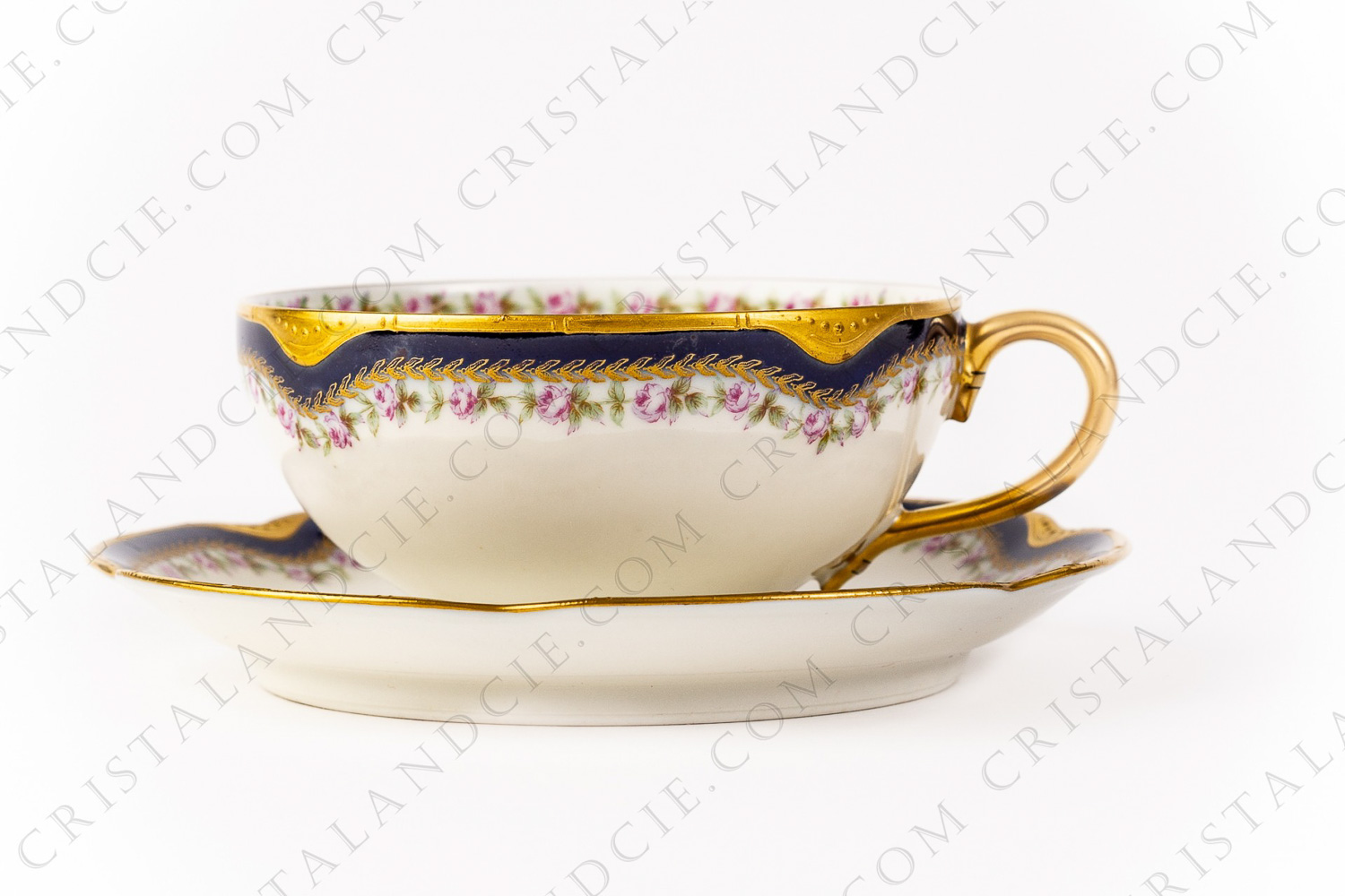 Tea cup in Limoges china by Haviland decorated with hand painted blue cobalt and gold stripes, and with friezes of polychromes roses photo-1