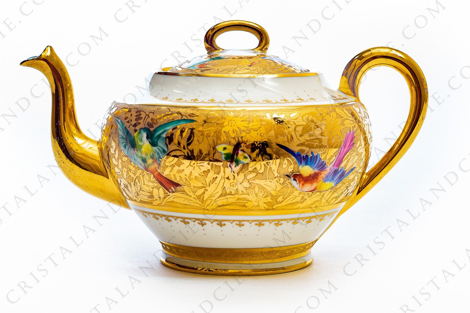 Tea pot in china hand painted by the workshops Le Tallec, decorated with polychromes enameled birds of paradise and butterflies on a gold flowered stripe photo-1