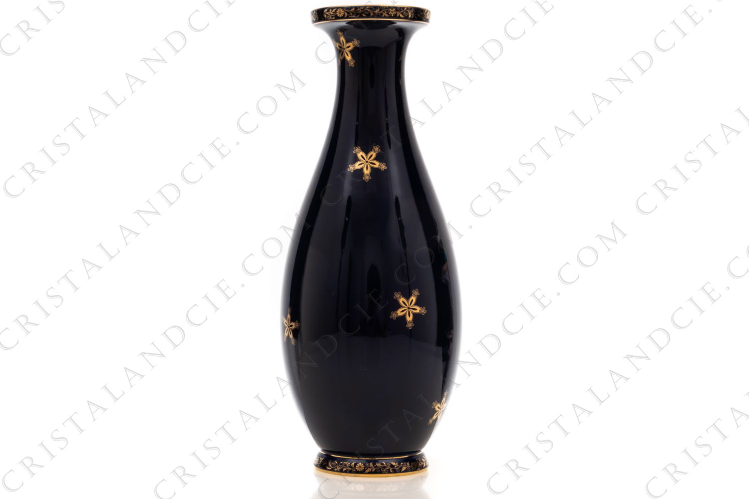 Vase in china by Sevres decorated with gold flowers on a colbalt blue background on the belly and with gold vegetable friezes on the foot and the neck photo-1