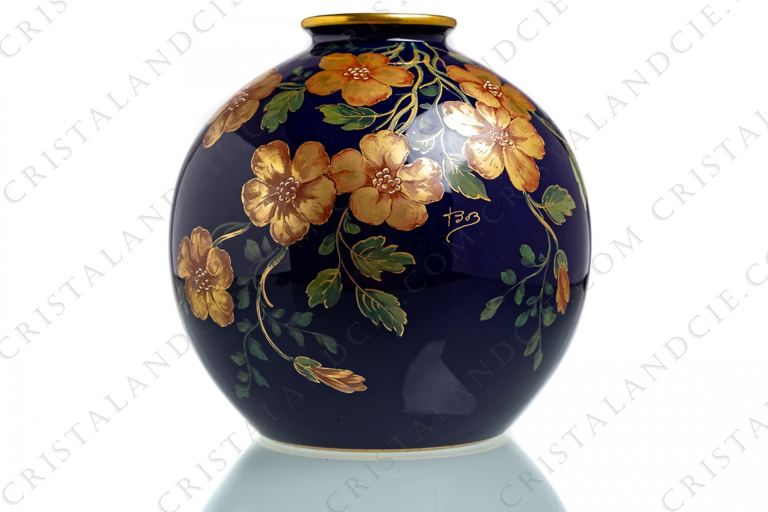 Ball vase in china of Limoges by Pastaud with a hand painted pattern of gold flowers and green gold enhanced leaves on a cobalt blue background photo-1