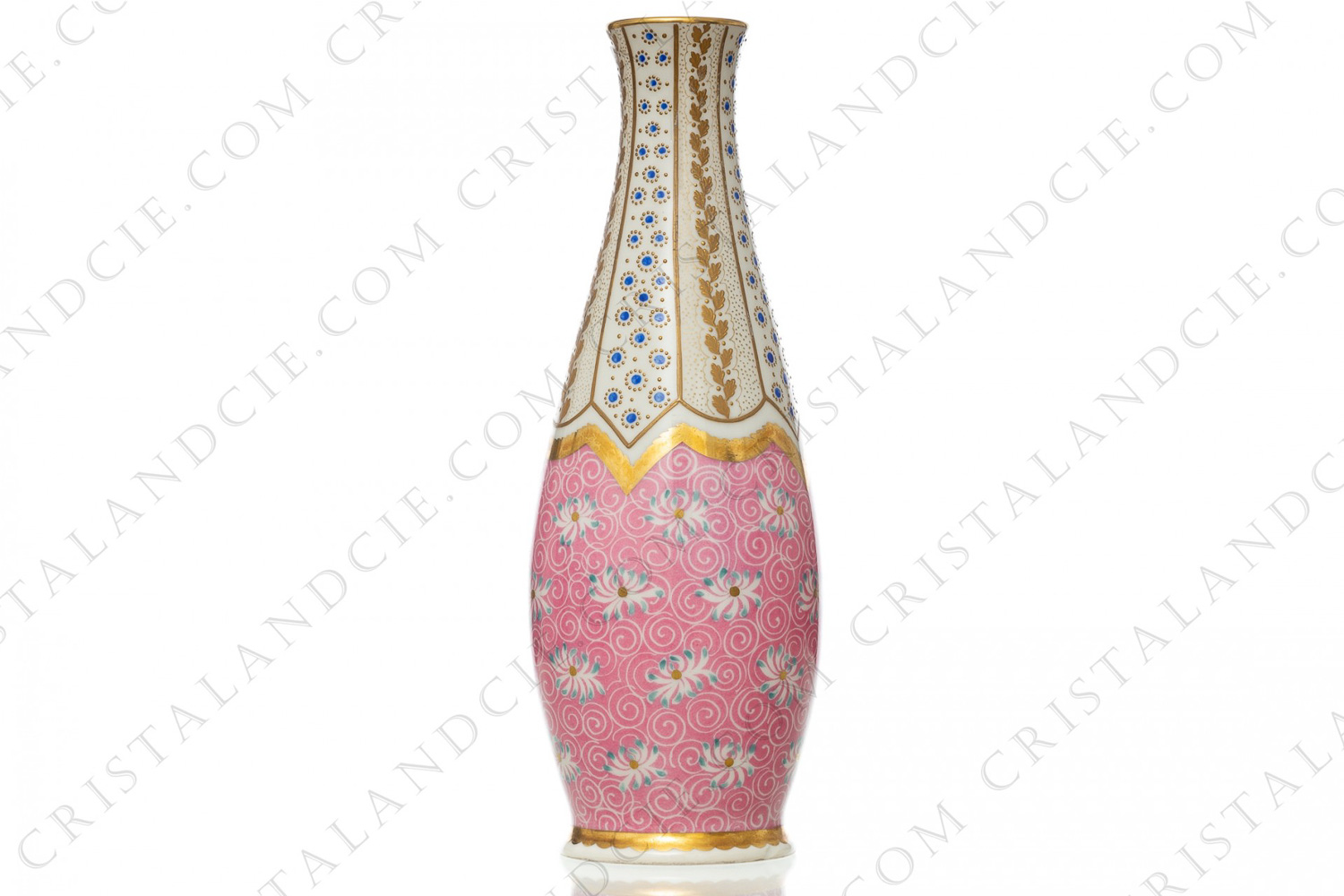 Vase in china of Limoges with a hand painted pattern on the lower part of blue and white flowers on a pink background, and of a hand enameled blue and gold flowers on the upper part photo-1