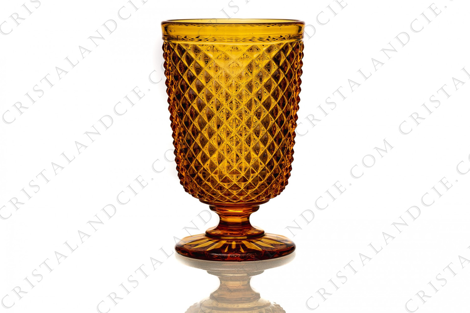 Watergoblet in amber molded crystal by Baccarat decorated with diamond tips and a golden strip photo-1